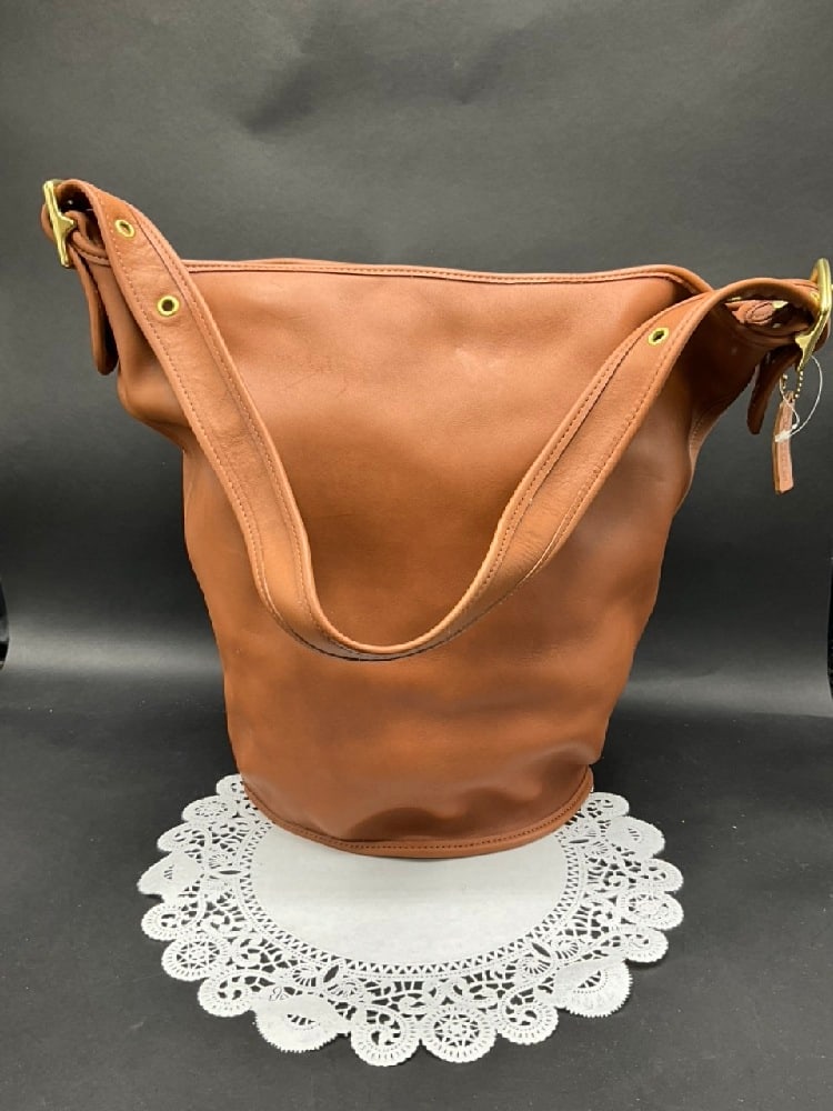 Vintage Coach Brown Leather Duffle Sac #9085: Vintage Coach Brown Leather Duffle Sac #9085.Dimensions: 13 1/2” x 13” Strap drop - 11”