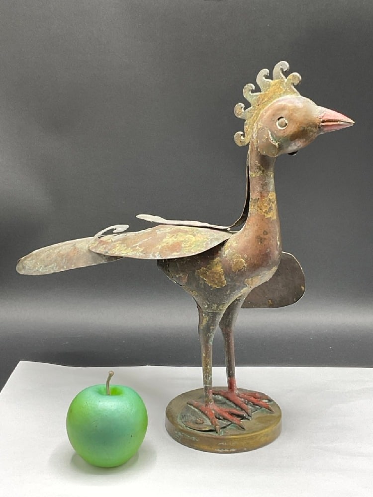 Antique Persian Bronze Bird Statue: Antique Persian Bronze Bird Statue. Remnants of old paint, mounted to a circular solid brass base. Left side wing has completely broken off and not with the statue.Dimensions: 14” x 16” x