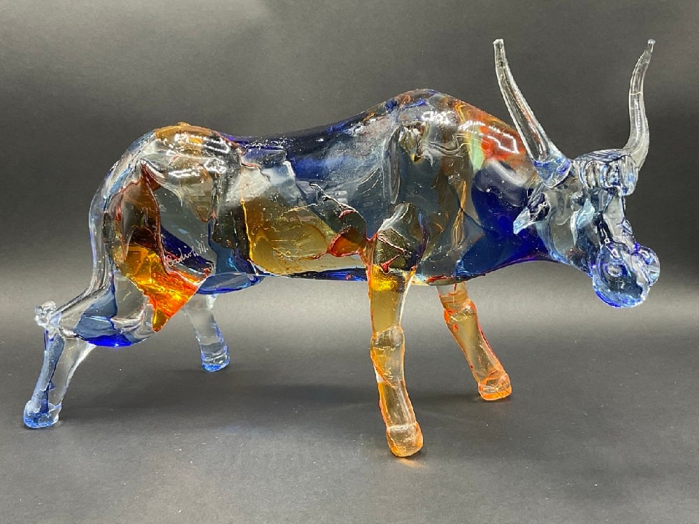 Artisan Signed Studio Glass Bull- Follow Up: Artisan Signed Studio Glass Bull. Illegibly signed. Chipped horn noted. Please see photograph preview. Dimensions: 8 1/2” x 15” x 4”