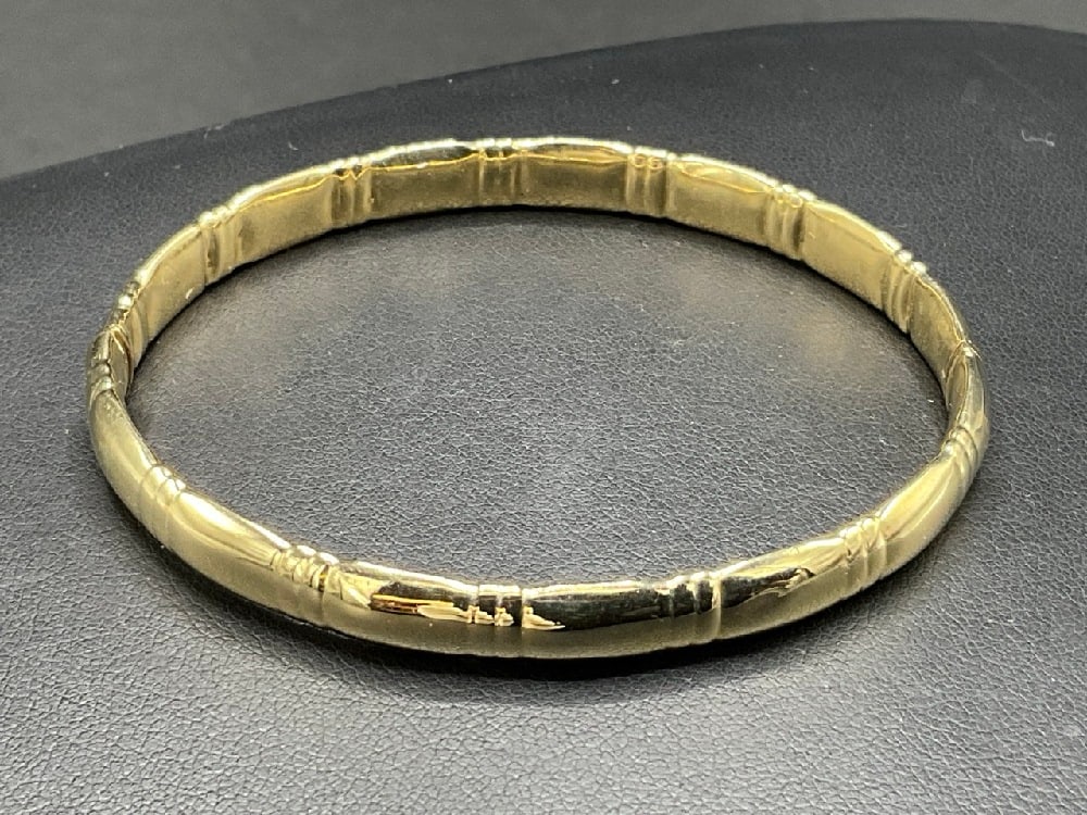 14K Yellow Gold Bamboo Style Hinged Bangle Bracelet: 14K Yellow Gold Bamboo Style Hinged Bangle Bracelet. Total weight: 7.9 grams.Dimensions: 2 3/8”/inside diameter and 6.6 mm width.