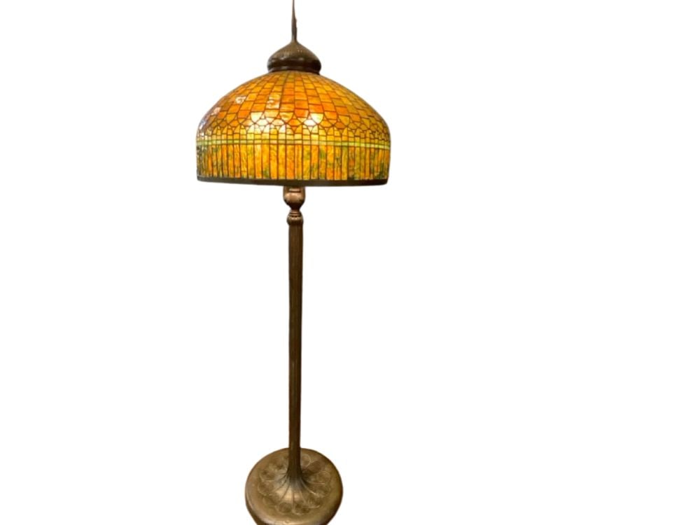 Tiffany Studios, New York Curtain Border Lead Glass and Bronze Floor Lamp: c. 1900-1910 Tiffany Studios, New York Curtain Border Lead Glass and Bronze Floor Lamp. A colorful leaded glass shade with "curtain border" measuring 24" set on a six (6) light floor lamp with circula