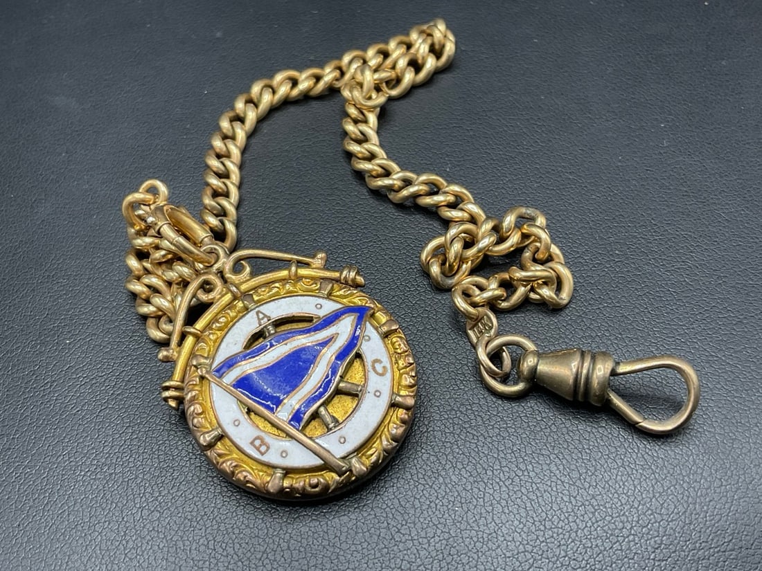 14K Yellow Gold Watch Fob Chain with 14K Yellow Gold Locket Fob with Enameled Flag: 14K Yellow Gold Watch Fob Chain with 14K Yellow Gold Locket Fob with Enameled Flag. Dimensions: 10 1/2” L 1901 Note: : Present from Benchmaker's Association.Total weight: 28.65 grams.