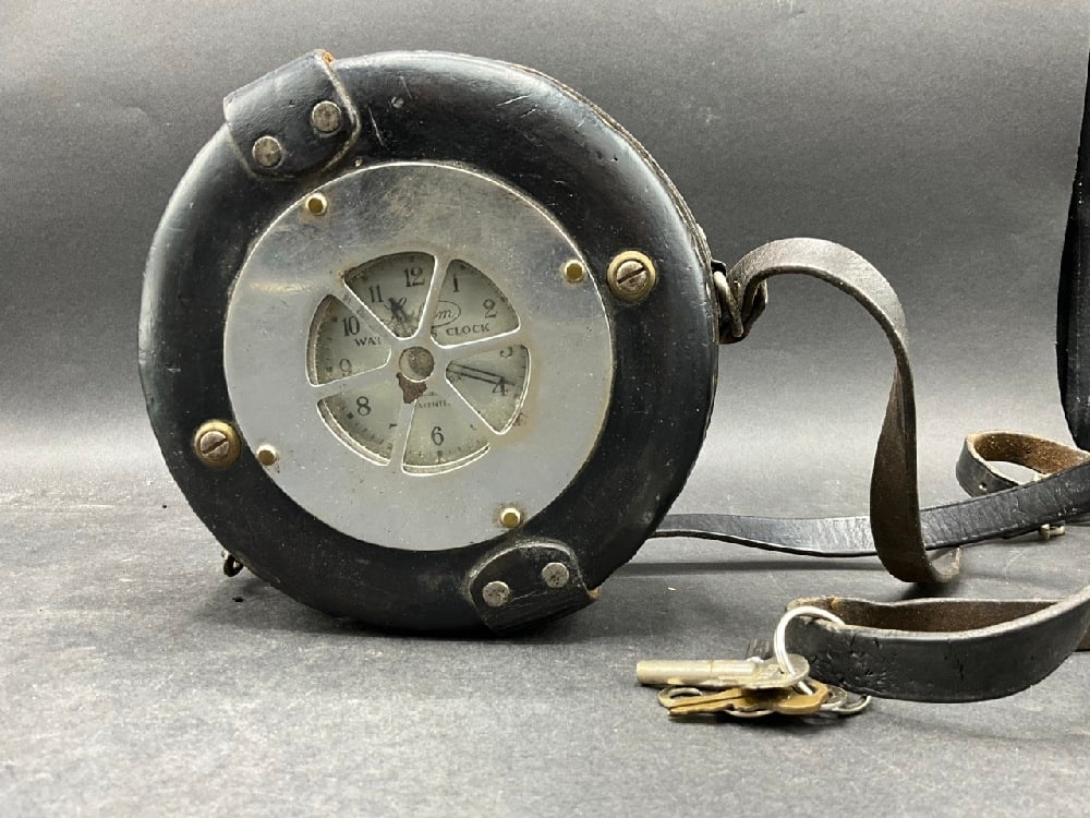 Latham Watchman Leather Bound Security Guard Clock: Latham Watchman Leather Bound Security Guard Clock.Dimensions: 6” x 6 1/2”