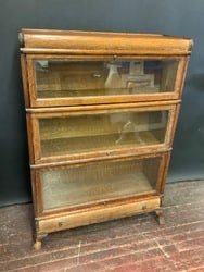 Three (3) Stack Lawyers Bookcase by Macey.Top door detached, repair needed. Some loss lower left (1 of 2)
