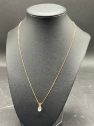 14K Yellow Gold Aquamarine Pendant Necklace: 14K Yellow Gold Aquamarine Pendant Necklace. Total Weight: 2.39 grams.Dimensions: 18” Chain.