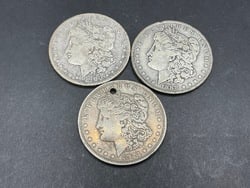 Three (3) U.S. Morgan Silver Dollars: Three (3) U.S. Morgan Silver Dollars.