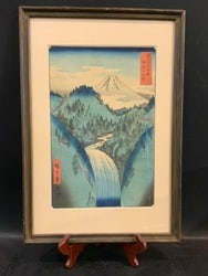 “In the Mountains of Izu Province?? - Utagawa Hiroshige: In the Mountains of Izu Province - Utagawa Hiroshige. This is from the series “Thirty-six Views of Mount Fuji”. Japanese Woodblock Print.Condition: Some water staining on waterfall.
