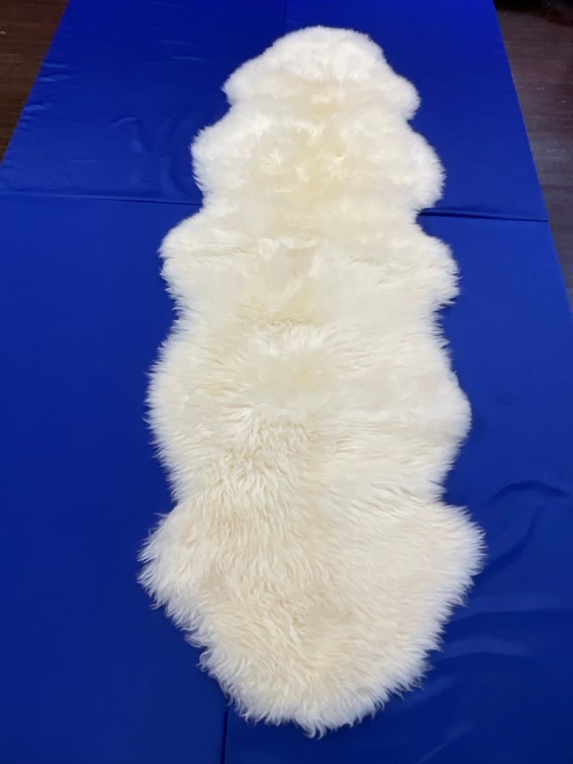 New Zealand Sheepskin Fur Rug 78" X 29": New Zealand Sheepskin Fur Rug. Very clean condition. Dimensions: 78? x 29?