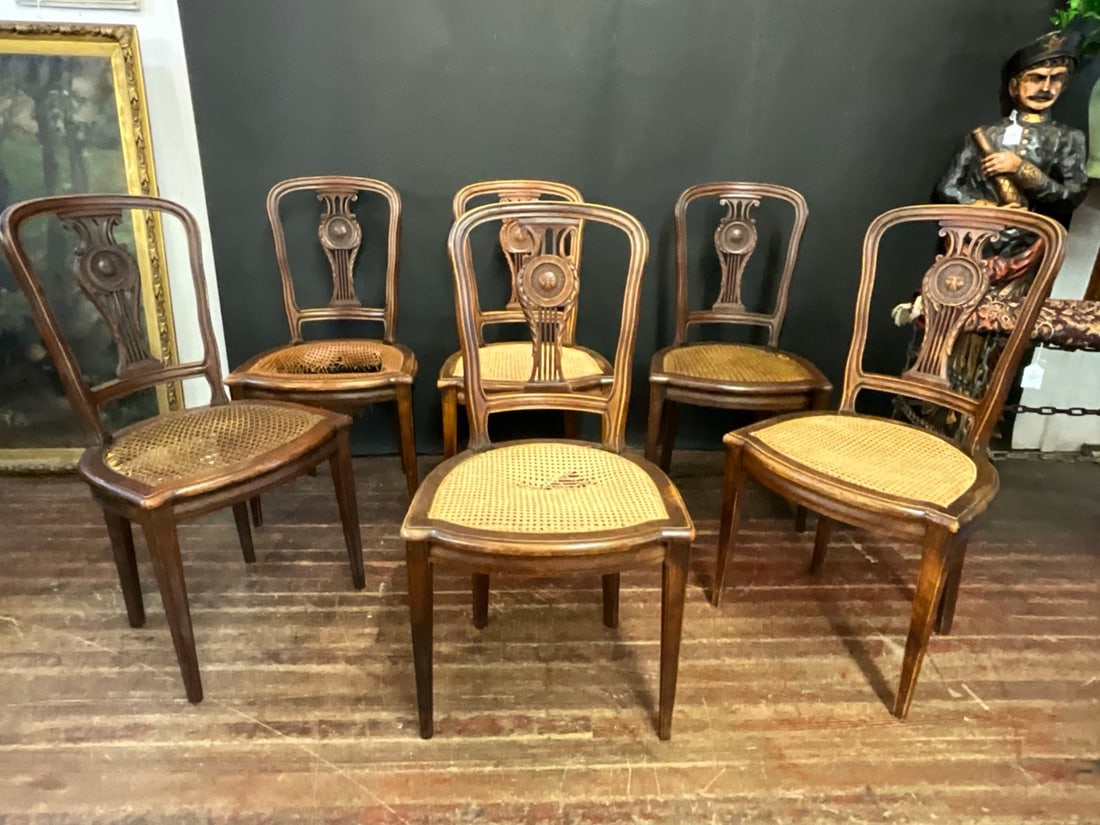Six (6) French Louis XVI-style Carved Sunburst Medallion Chairs: Six (6) French Louis XVI-style Carved Sunburst Medallion Chairs. Some chairs need re-caning. Please see photograph preview. Dimensions: 36? H x 18 1/2?W x 16 1/2? D