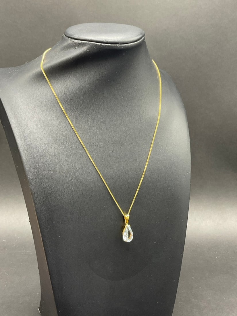 18K Yellow Gold 17 inch. Curb Link Necklace with Pear Shaped Aquamarine Pendant: 18K Yellow Gold 17 inch Curb Link Necklace with Pear Shaped Aquamarine Pendant.Dimensions: 13mm x 11mm x 5.5mm stone. Total weight: 4.1 grams .