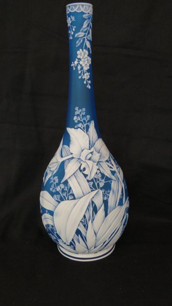 15 1/2" Tall Thomas Webb Blue Cameo Vase: Thomas Webb Blue Cameo glass vase in outstanding mint condition. Very fine detail not spared. Sticker at base from previous owner "Seedttt" for identification. This vase comes with original receipt of