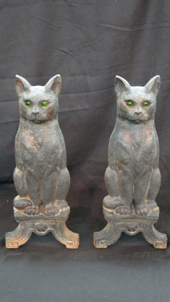 Antique Cast Iron Figural Black Cat Andirons: A Pair of Antique cast iron figural black cat andirons with green glass inset eyes. Dimensions:17"h X 7.5"w