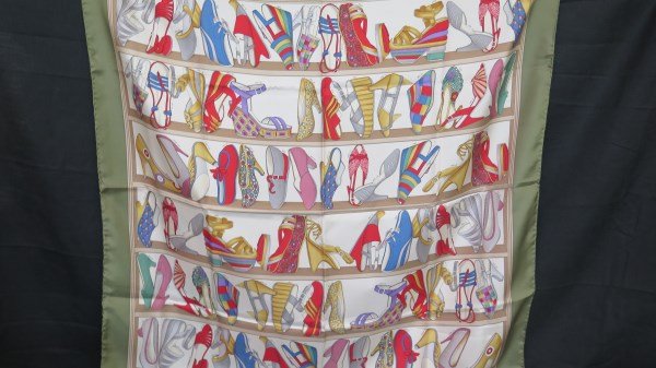 Salvatore Ferragamo Designer Shoe Print Silk Scarf: A Ferragamo silk scarf. Made in Italy. A collection of Ferragamo shoes designs with year of design pattern. Dimensions:34" X 34" . Inv.356