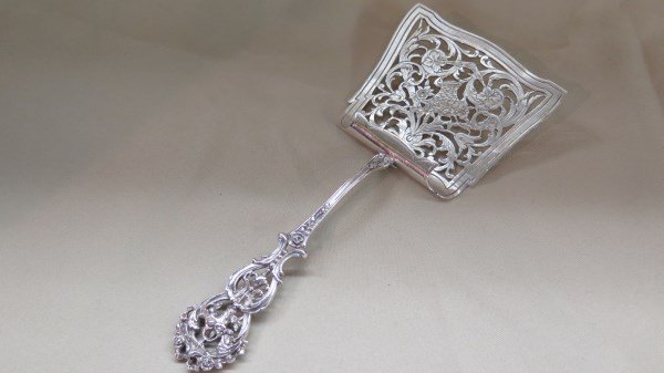 Antique Hallmarked Fish Server 19th Century.: A Fine Sterling silver server with ornate design. Please see photograph preview for Hallmarks. Dimensions: 8 3/4" X 3 3/4" . t.w. 3.74 avg. oz. Inv. 404
