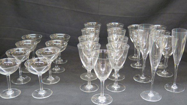 25 Pieces of Baccarat French Crystal Stemware: A Grouping of Fine stemware by Baccarat. Made in France. Consists of 25 pieces all being in the same pattern. Quantity 8:Champagne 5"X 3 3/4"Quantity 9 :Lg. Wine 7" X 3 1/2"Quantity 5: Small Wine 6 1/