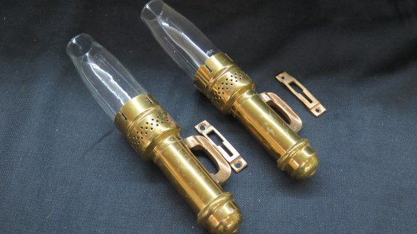 Pair of Pullman Car Lamps: Pair Pullman car brass oil lamps. Comes with brackets for mounting. Good condition. All original workings. Dimensions: 11.5" X 2" with chimney. Inv. 452