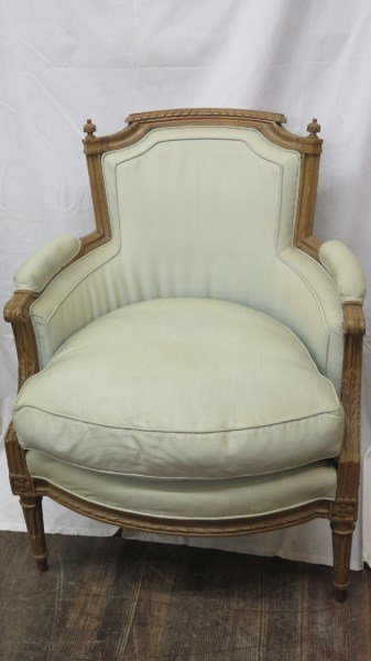 Louis XVI GI Jacob Chair: A Louis XVI upholstered armchair, late 18th century, stamped G+IACOB (Georges Jacob, maitre, b. 1739, d. 1814) on back of rail, the shaped crest over a shaped upholstered back descending to padded arm