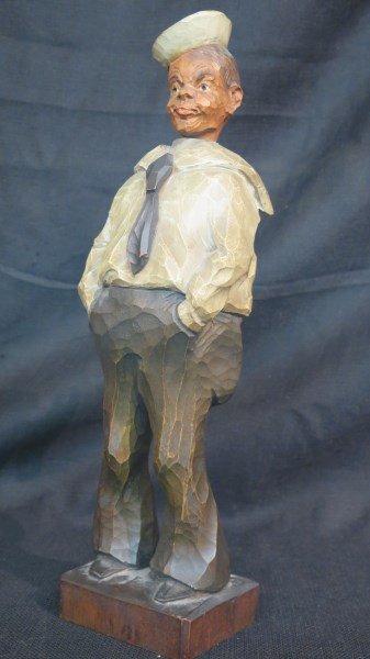 German Clock Work Whistler: A Wood Carving Made in Germany. A clock work movement that allows sailors head to move side to side and whistles. The bellows need repair. Winds but bellows are dried out. Dimensions: 14.5" X 4.25"