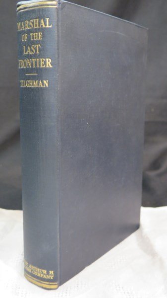 Marshall of the last frontier: Life and services ..1949: Tilghman (wife) Zo A. Marshall of the last frontier: Life and services of William Matthew (Bill) Tilghman...Glendale, CA: Clark, 1949. Note: Howes P-430, scarcest binding.Inv.502
