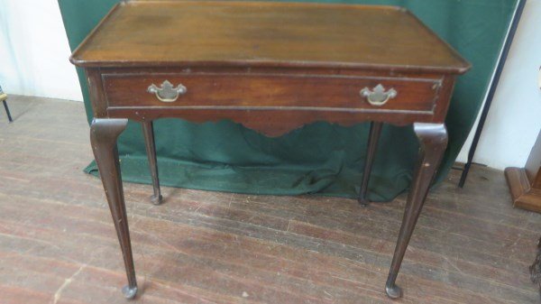 Early 20th Century Mahogany Tea Tables: Early 20th Century Mahogany Tea Tables - A pair of Queen Anne style tables, 20th century, each with galleried top above a frieze fitted with a drawer, raised on angular cabriole legs ending in pad fee