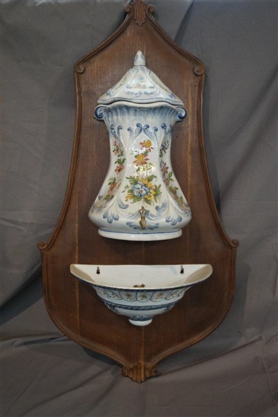 An Antique Italian Lavabo Wash Basin: An antique Italian Lavabo wash basin. Family descent from Switzerland. This basin is mounted to a Walnut plaque. Early 20th century, handpainted. Dimensions: 32" X 17" Overall. Inv. 59