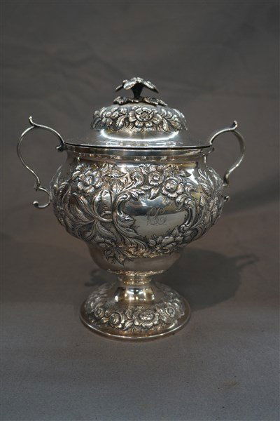 Andrew E. Warner American Coin Silver Covered Pot: Andrew E. Warner (American, 1804-1870) American coin silver pot. Fine repousse work with applied handles. Floral finial top. Signed A.E. Warner and number "11". Monogrammed "C.C". Dimensions: 7 3/4" H