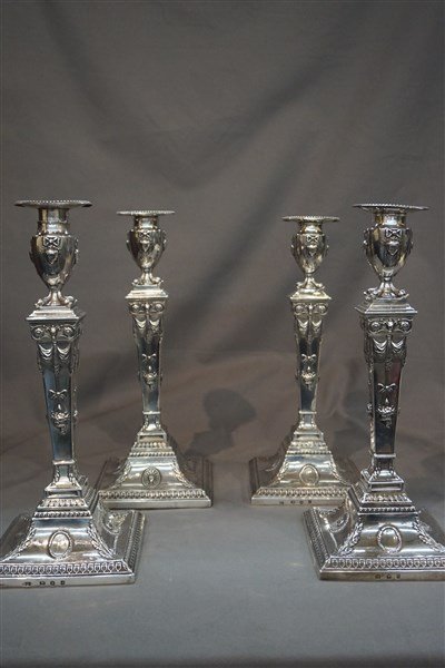 Four George III Sterling Silver English Candlesticks: Four George III period sterling silver candlesticks. Hallmarked for London c. 1779 by partnership of Richard Carter, Daniel Smith and Robert Sharp. Highly ornate columns with female figural heads, foo