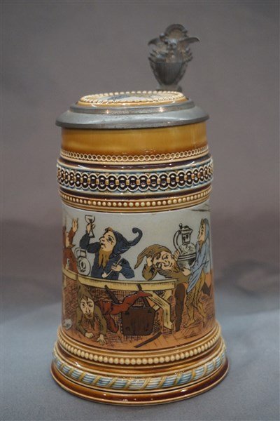 Mettlach # 1479 Dwarves Drinking Wine German Stein: Mettlach #1479 Drunken Dwarves drinking wine. German stein. Pewter lid with embossed United States seal. Dimensions: 8" X 6"