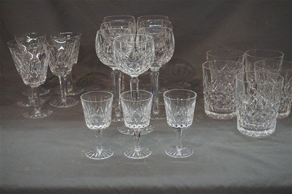 20 Pc. Comprised Group Waterford Lismore Stemware: A comprised grouping of stemware. Waterford Lismore pattern. Five (5) Old Fashions 4 1/2"Three (3) Sherry 4 1/2" Five (5) Wine Glasses 6"Seven (7) Water Goblets 7 1/2"