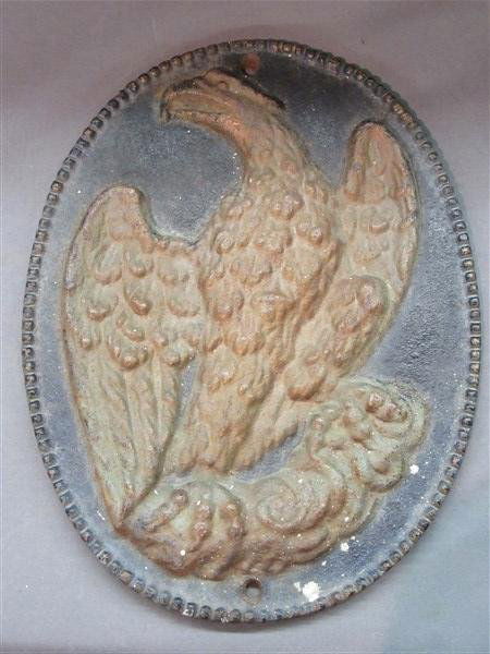 Cast Iron Insurance Eagle Fire Mark: A cast iron insurance fire mark. Signed reverse Ins. Co. Of N.A. Fire Mark Issued in 1830. Dimensions: 11" X 8 1/2"