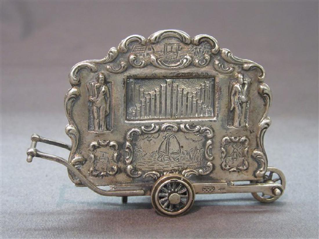 Continental Sterling Silver Travelling Miniature Organ: A Continental sterling silver travelling miniature organ. Dimensions: 2 1/2" X 2" t.w.: 1.5 avg. oz.