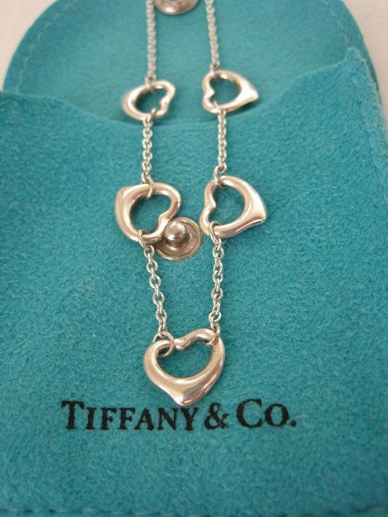 Tiffany & Co Elsa Peretti 5 Open Heart Necklace 16": Tiffany & Co Elsa Peretti 5 Open Heart Necklace in sterling silver and 16" in length. This item comes with snap pouch.