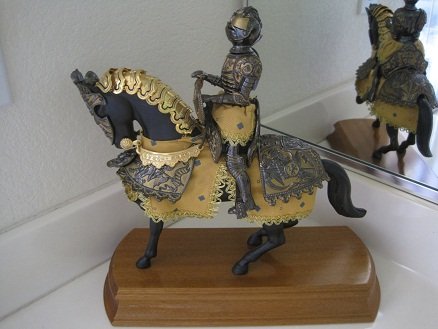 Marto Miniature Black Knight on Horseback MA5600: Pre-owned Miniature Black Knight on HorsebackThe mounted Black Knight (MA5600), representing figures from history in tournament armor, is beautifully crafted and decorated in the heraldic symbols of t