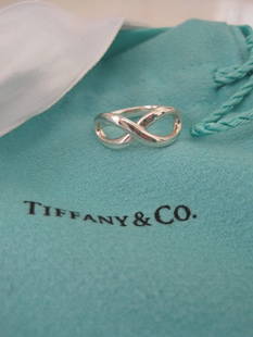 Tiffany & Co MINT Sterling Silver Infinity Ring Sz 4.5: Tiffany & Co Infinity Ring Size 4.5 in brand new condition. Worn maybe once. Comes with all the original packaging, pouch, box and ribbon.