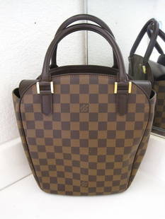 Authentic Louis Vuitton LV Brown Damier Tote Bag: authentic Louis Vuitton Damier Tote Bag. The bag is 10 1/2" tall by 9 1/2" wide by 3 3/4" deep. This bag is in good condition. There is a light stain on the inside bottom. Please look at all the