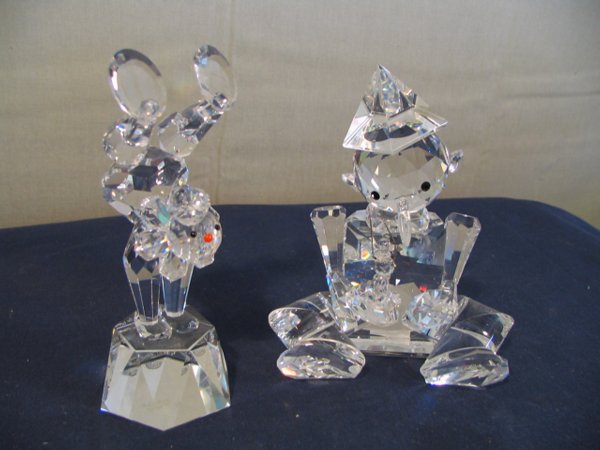 Olga Plum Crystal Zoo figurines, Acrobat Clown #21: Olga Plum Crystal Zoo figurines, Acrobat Clown #215/7500 with cert of Auth., 5 inches tall; other figurine signed Gina Truex, 533/5000, looks like Pinochio holding puppy, both in good condition with n