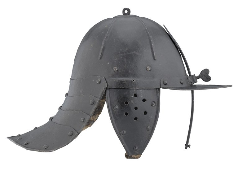 **A GERMAN ZISCHÄGGE, MID-17TH CENTURY with one-piece: **A GERMAN ZISCHÄGGE, MID-17TH CENTURY with one-piece hemispherical skull embossed with six radiating ribs and fitted at its apex with a transversely-pierced finial and circular washer, at its brow w
