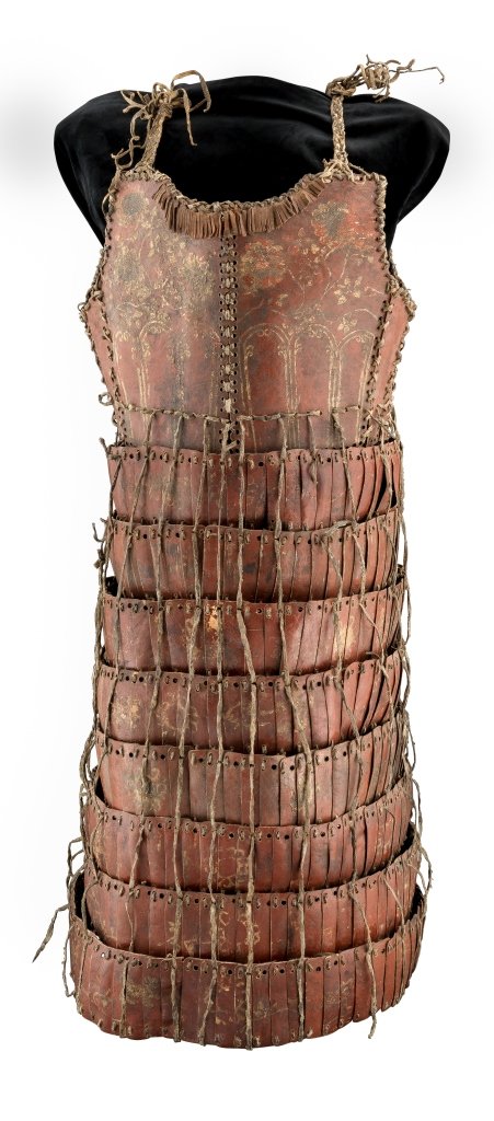 A RARE EAST TIBETAN DECORATED LEATHER LAMELLAR ARMOUR,: A RARE EAST TIBETAN DECORATED LEATHER LAMELLAR ARMOUR, 15TH/17TH CENTURY formed of two pairs of plates covering the chest and the back of the torso, open at the front and fitted with two slender plate