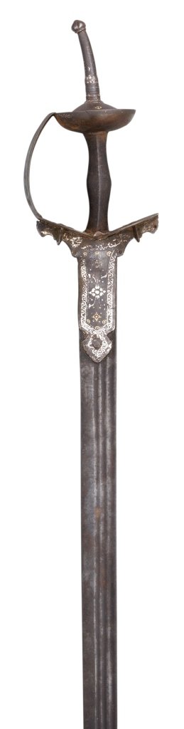 **AN INDIAN SWORD (FIRANGI), 18TH CENTURY with European: **AN INDIAN SWORD (FIRANGI), 18TH CENTURY with European straight blade double-edged towards the point, formed with three long fullers of differing length on each face, iron hilt of characteristic form
