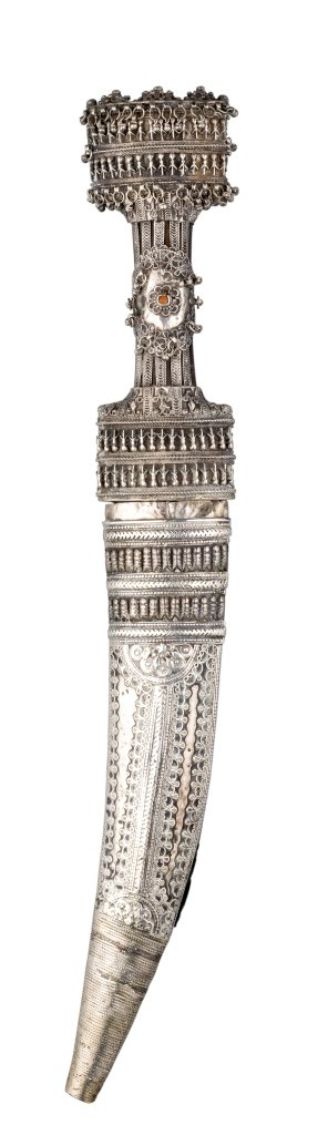**AN OTTOMAN SILVER-MOUNTED DAGGER (JAMBIYA), 19TH: **AN OTTOMAN SILVER-MOUNTED DAGGER (JAMBIYA), 19TH CENTURY with curved flat double-edged blade, shaped hilt almost entirely encased in silver, including bands of elaborate beadwork, filigree and rows