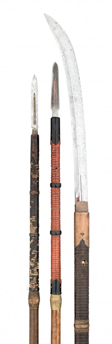 TWO JAPANESE SPEARS (YARI) AND ANOTHER (NAGINATA), EDO: TWO JAPANESE SPEARS (YARI) AND ANOTHER (NAGINATA), EDO PERIOD the first with short head of triangular section, on a wooden haft (head seized in its socket, shoe missing); the second similar, with plai