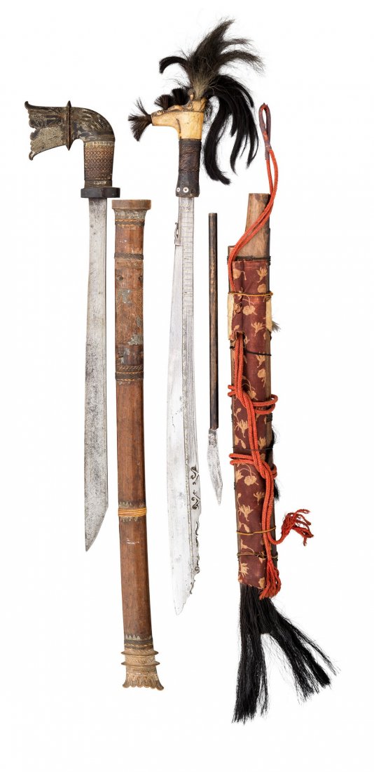 A DYAK HEAD HUNTER'S SWORD (MANDAU), AND A MORO SWORD,: A DYAK HEAD HUNTER'S SWORD (MANDAU), AND A MORO SWORD, 19TH CENTURY the first with characteristic blade inlaid with brass pellets on one face, carved bone hilt bound with rattan, in its wooden scabbar