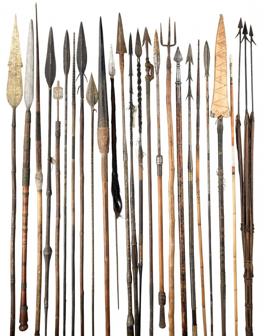 TWENTY FOUR SPEARS, AFRICA, 19TH/20TH CENTURY including: TWENTY FOUR SPEARS, AFRICA, 19TH/20TH CENTURY including a 'currency' spear with brass head, an Upper Congo spear, a Zulu spear, a Nigerian spear, and a Gabon river spear, each on its haft (24)