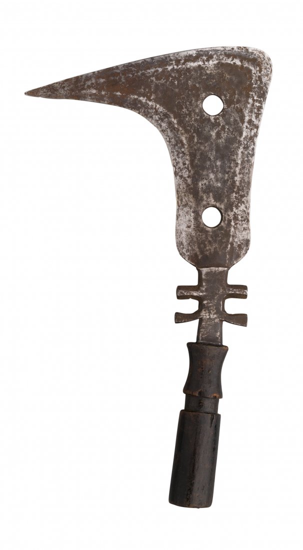 A MANGBETU TRIBE SICKLE KNIFE, CONGO, LATE 19TH: A MANGBETU TRIBE SICKLE KNIFE, CONGO, LATE 19TH CENTURYwith steel blade of beaked form, pierced with a pair of circular apertures and with two basal lugs, and carved hardwood grip26 cm; 10 1/4 in head