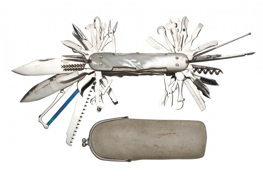 A SWISS EXHIBITION MULTI-BLADE FOLDING KNIFE BY: A SWISS EXHIBITION MULTI-BLADE FOLDING KNIFE BY SCHODER, THUN, LATE 19TH CENTURYwith German silver body faced with faux mother-of-pearl plaques on each side, fitted with approximately fifty two variou