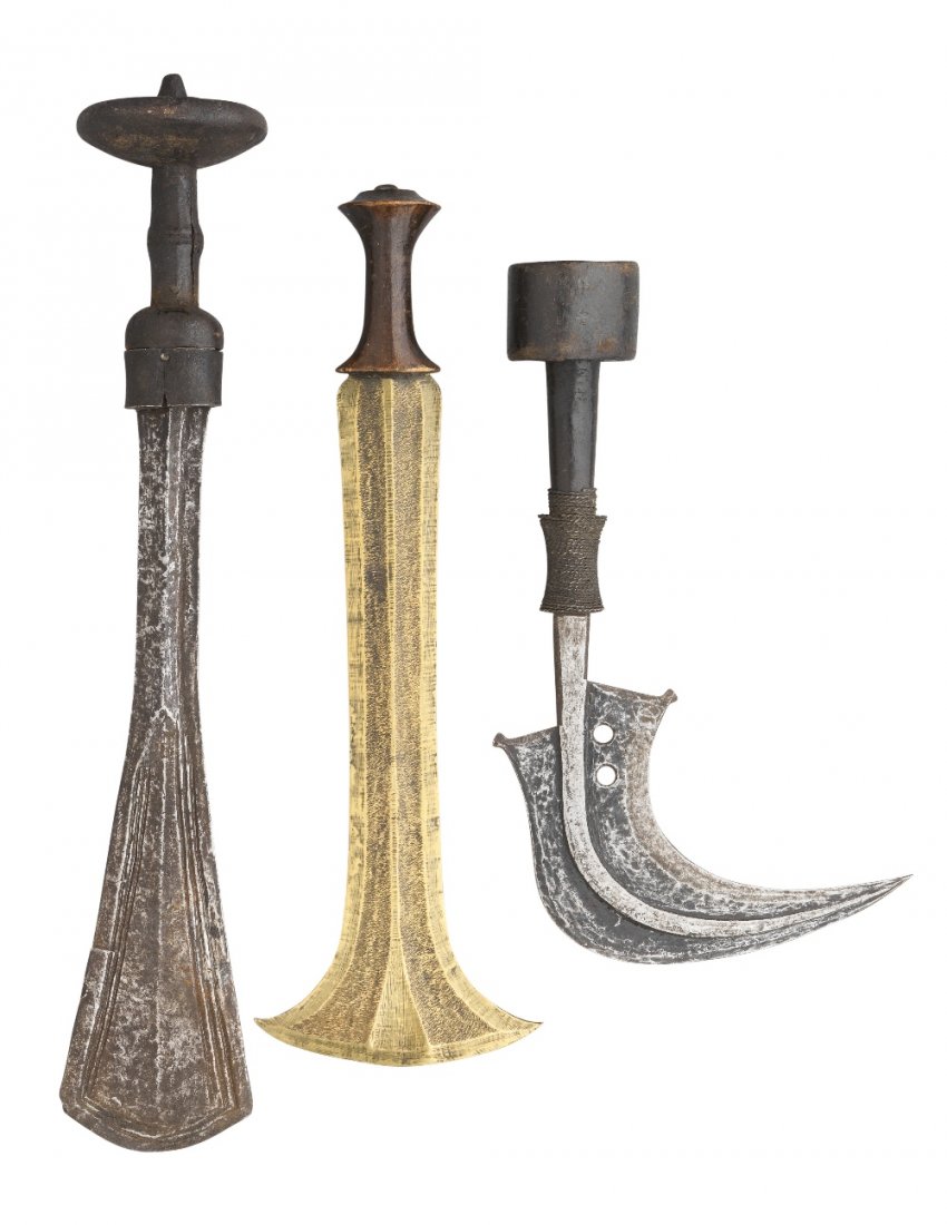 SIX AFRICAN EDGED WEAPONS, 19TH/20TH CENTURY comprising: SIX AFRICAN EDGED WEAPONS, 19TH/20TH CENTURY comprising a Kuba sword (Ilwoon), with flat blade widening towards the tip, carved hardwood grip including large disc pommel; the second Central Africa, wi