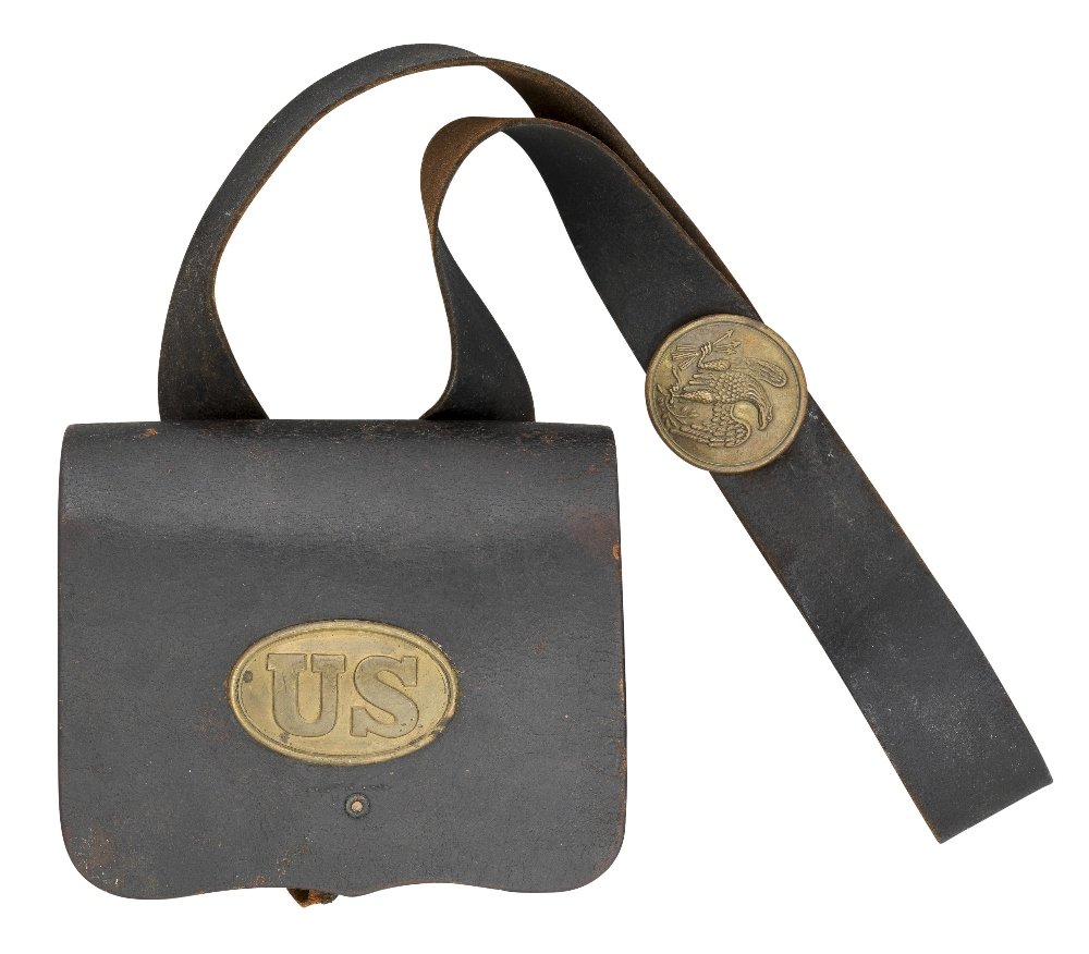 A LEATHER CARTRIDGE BOX, CIRCA 1855-65 of stitched: A LEATHER CARTRIDGE BOX, CIRCA 1855-65 of stitched leather, the inner flap embossed 'H.W.OLIVER, PITTSBURGH, PA' complete with its tinned compartment liners, the flap with 'U.S.' brass plaque and the