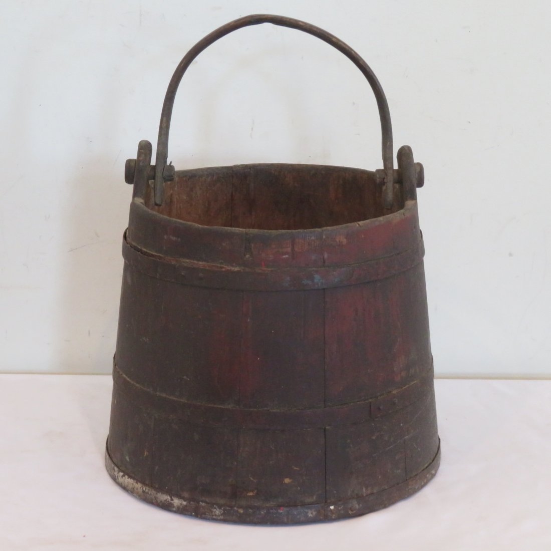 Wood pail with wood handle: Wood pail with wood handle, metal staves, old dark natural patina, 17" x 11"