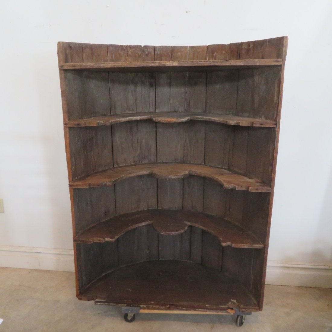 18th century built in corner cupboard w/ shaped shelves: 18th century built in barrel back corner cupboard with butterfly shelves in old dry natural surface, rose head nail construction, 59" t. x 43" w. x 19" d.