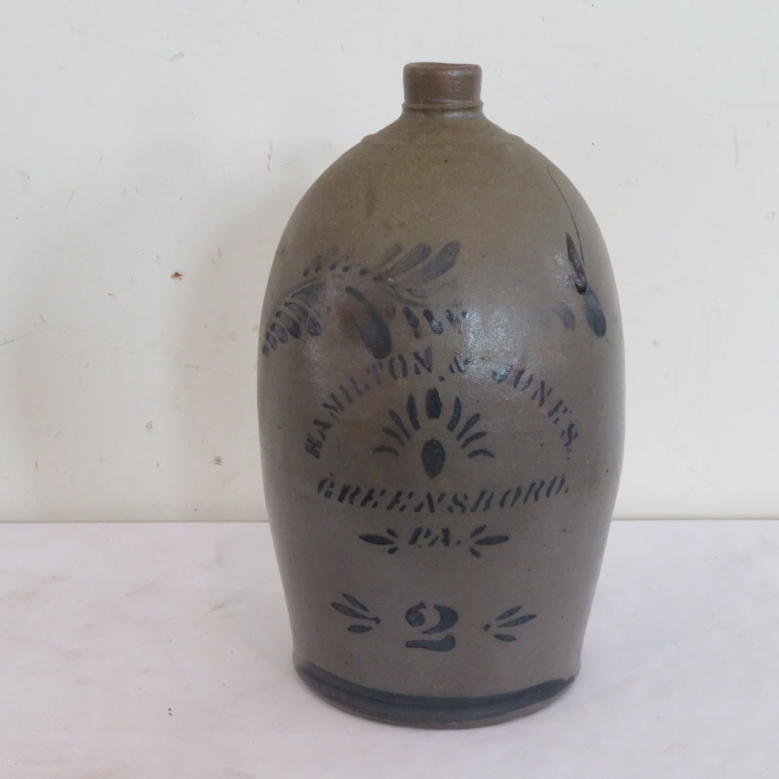 Hamilton & Jones 2 gal. stoneware jug: Western Pa. Hamilton & Jones, Greensboro, Pa. 2 gal. stoneware jug with stenciled and free hand decoration, 15" x 8"